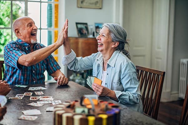 Couple celebrating at table