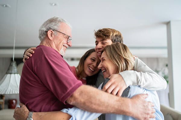 Family hugging and happy