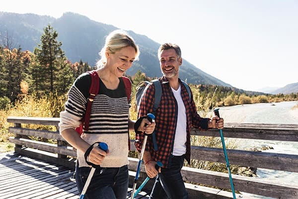 A couple hiking on a boardwalk